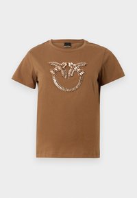 Brown cotton t-shirt featuring a decorative gem and bead design on the front. Round neckline and short sleeves with a relaxed fit.