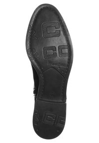 Semelle de chaussure en cuir noir avec des coutures visibles, une marque en relief et le numéro de taille 37 au centre.