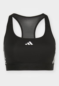 Black athletic sports bra with a mesh racerback, featuring white three-stripe accents on the sides and an elastic band with logo detail.