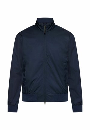 Veste bleu marine zippée avec col montant, poignets et ceinture élastiques, dotée de poches latérales et d'une texture de tissu lisse.