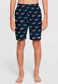 Bañadores para niños hechos de una tela ligera, con una base azul marino y un colorido patrón de ojos en tonos verdes, marrones y cremosos.