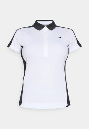 Polohemd in Weiß mit schwarzen Akzenten, mit einem Kragen, einer Knopfleiste mit drei Knöpfen und kurzen Ärmeln. Hergestellt aus glattem, leichtem Stoff.