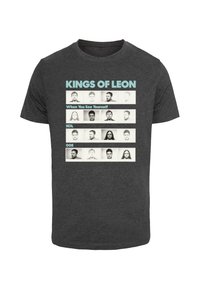 Dark gray T-shirt with the text “KINGS OF LEON” and “When You See Yourself” in light blue. Features black and white headshot images in rows.