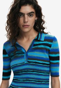 Blue striped polo shirt with ribbed texture, featuring short sleeves, a collared neck, and two buttons at the front. Accents in black and green.