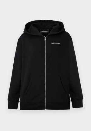 Black zip-up hoodie made of soft fabric with a front pocket, featuring a hood and a small white logo on the chest.