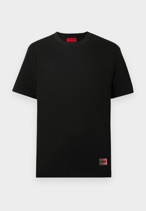 Black cotton T-shirt with a crew neck, short sleeves, and a square logo patch in red on the lower left side. Simple and minimalistic design.