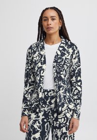 Navy and cream patterned blazer with a tailored fit, featuring a notched collar, two front pockets, and a smooth, textured fabric.