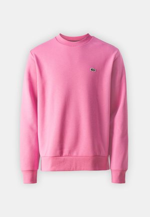 Sweatshirt rosa feito de tecido suave, com decote redondo, mangas longas, punhos e bainha canelados, e um pequeno detalhe de logo verde.