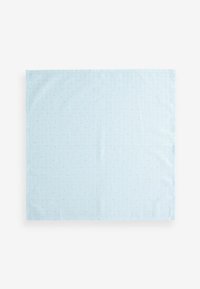 Light blue placemat with a smooth texture, featuring vertical stripes and small blue dots throughout. Rectangular shape, minimalist design.