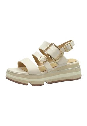 Sandalo platform beige con tre cinturini regolabili con fibbia e suola beige e bianca scanalata.
