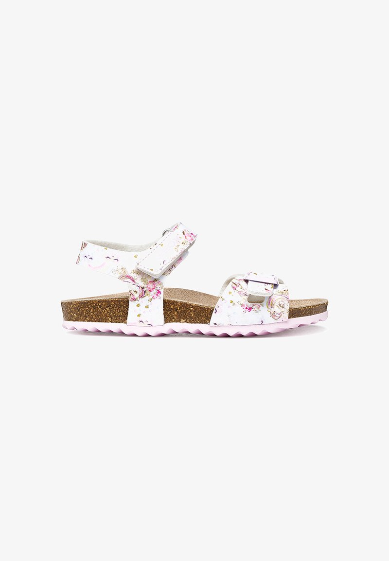 Sandale blanche à fleurs pour enfants avec semelle intérieure en liège, brides en velcro réglables sur les orteils et autour de la cheville, et semelle en caoutchouc rose.