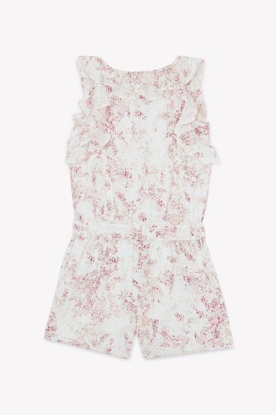 Blommig jumpsuit i vitt med ljusrosa och lila blommönster. Har volangaxlar och ett bälte i midjan. Mjuk, lätt tyg.