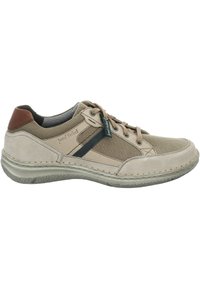Baskets décontractées beige et marron clair à lacets, avec une bande foncée, une semelle rembourrée et un accent brun au talon, étiquetées Josef Seibel sur le côté et sur l'étiquette.