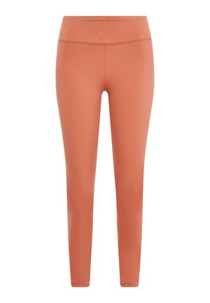 Peach-colored leggings made from stretchy fabric, featuring a high waistband and a smooth texture, with slim, straight legs.