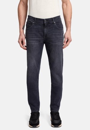Dark gray denim jeans with a straight cut, five-pocket design, and subtle whiskering on the front. Paired with black sneakers.