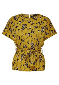 Blusa floreale gialla con maniche corte, vita cintrata e dettaglio con fiocco. Presenta un motivo floreale blu navy su un tessuto leggero.