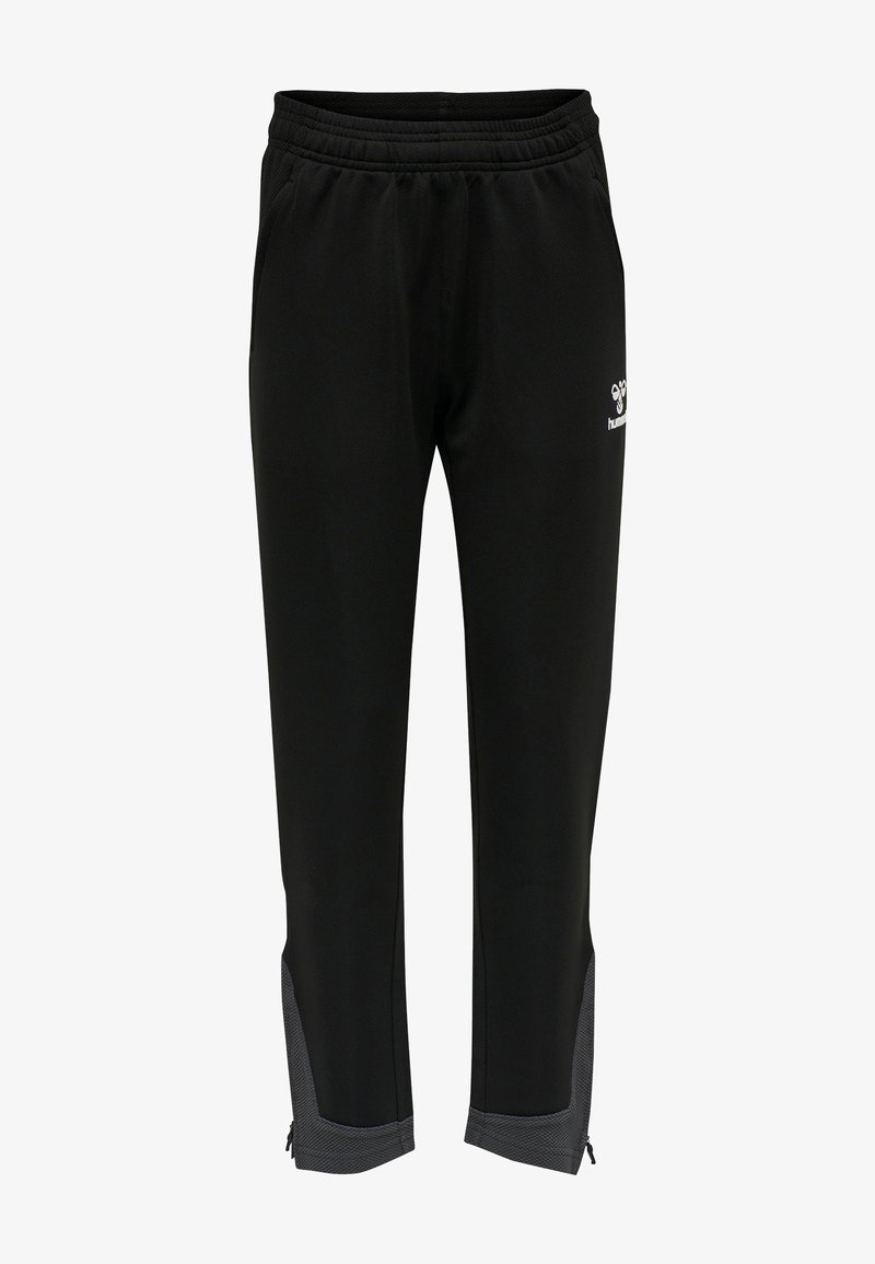 Svarta träningsbyxor med elastisk midja, sidofickor och grå mesh-dekonstruktioner vid nedersta delen av benen. Har blixtlås vid vristerna.