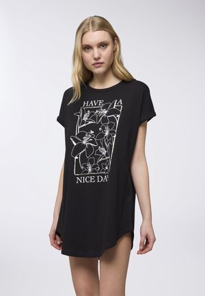 Abito t-shirt in cotone nero con design grafico floreale e la scritta "HAVE A NICE DAY" in bianco. Maniche corte e vestibilità ampia.