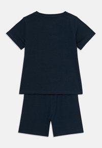 Navy blue short-sleeve T-shirt and matching shorts made of soft cotton. Simple design with a crew neckline and an elastic waistband.