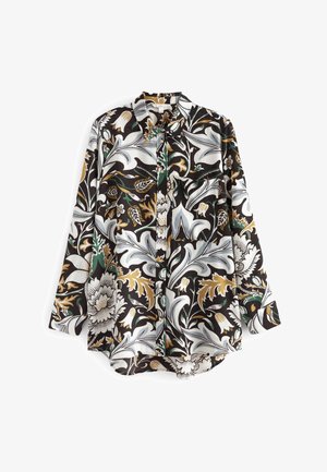 Chemise à manches longues avec un motif floral sombre dans des tons d'or, de vert et de blanc. Fabriquée en tissu léger, elle présente un devant à boutons et un col.