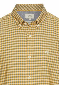 Korte mouw knoopshirt in een geel en grijs ruitpatroon. Heeft een borstzak en contrasterende stof voor de binnenkraag. Regular fit.