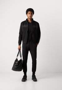 Antony Morato TROUSERS METAL EFFECT RUBBER LOGO - Pantalon de survêtement - black