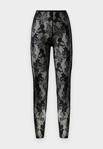 Leggings de renda preta com padrão floral, tecido transparente e um ajuste justo, com uma cintura suave e bainhas fechadas.