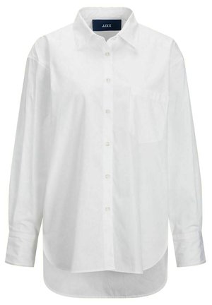 Hvid langærmet skjorte i glat bomuld med knapkrave, frontlomme og buet nederkant. Har en rygskulder for ekstra struktur.