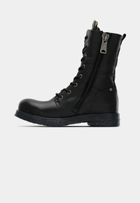 Black leather ankle boot with laces and side zipper, rounded toe, textured sole, and metallic accents on eyelets and zipper.
