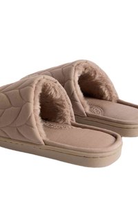 Beige gewatteerde instapslippers met een zachte bontvoering en een gevoerde zool, ontworpen voor binnencomfort.