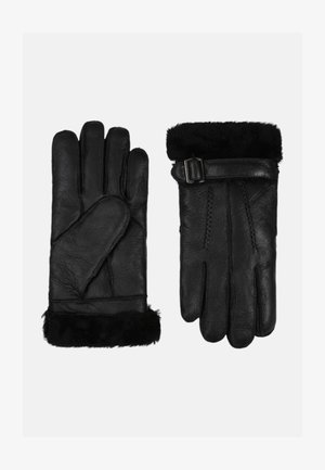 Guanti neri in pelle con rifinitura in pelliccia al polso, caratterizzati da un dettaglio con fibbia e cuciture dettagliate sul palmo e sulle dita.