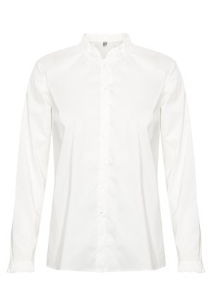 Camisa blanca de botones de manga larga hecha de algodón. Presenta un cuello y puños con volantes. Corte recto con una textura suave.