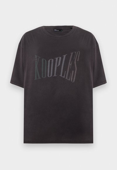 Μαύρο t-shirt με κοντά μανίκια και το κείμενο «THE KOOPLES» τυπωμένο με μεγάλα, ξεθωριασμένα γράμματα στο στήθος.