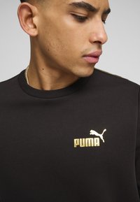 Puma ESS TAPE MINIMAL RUNDHALS - Sudadera - black