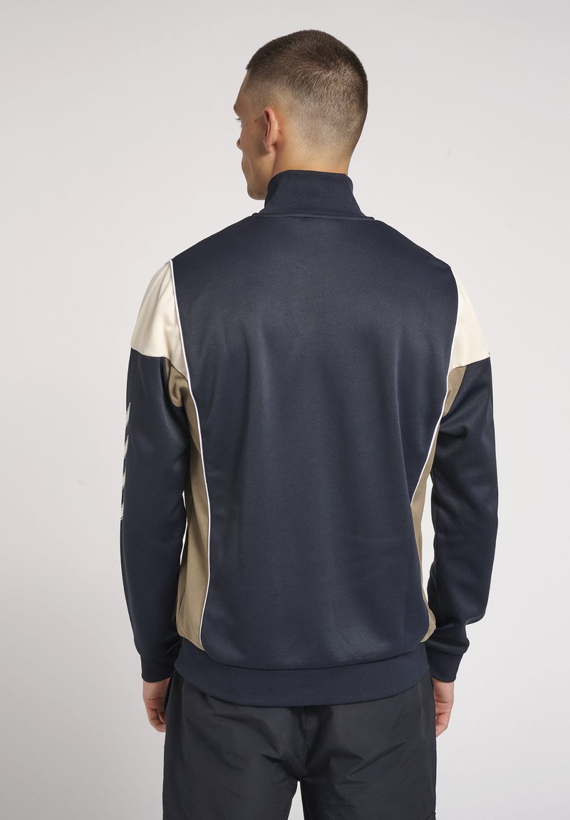 Damen Sportbekleidung | Hummel Hive Übergangsjacke dark navy/dunkelblau - IY49825 Damen Sportbekleidung | Hummel Hive Übergangsjacke dark navy/dunkelblau - IY49825