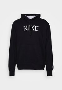 Svart huvtröja med ficka fram, dragsko och vit "NIKE" logotyp på bröstet. Mjuk tyg med ribbade ärmar.