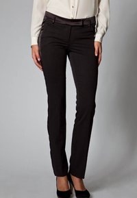 Black tailored pants with a sleek design, featuring a smooth fabric, fitted silhouette, discreet pockets, and subtle waistband detailing.