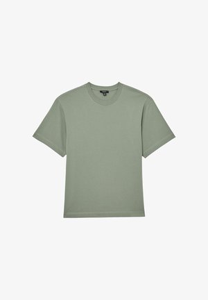 Īsām piedurknēm t-krekls no viegla, mīksta zaļa kokvilnas auduma. Tam ir apaļa apkakle un taisna piegriezuma dizains.