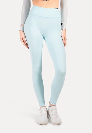 Ljusblå höga leggings i mjukt, stretchigt material, designade för aktiv användning. Har en sömlös midja och en tight passform.