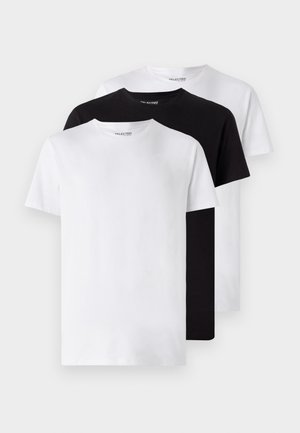 Drei grundlegend runde Hals-T-Shirts in Weiß, Schwarz und Weiß. Kurzärmlig, aus Baumwolle, minimalistisches Design, keine sichtbaren Muster oder Akzente.