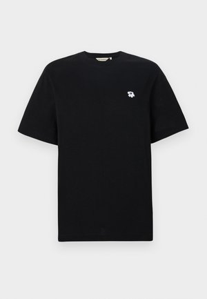Black cotton t-shirt with short sleeves, featuring a small white flower embroidery on the left chest. Standard fit and crew neck design.