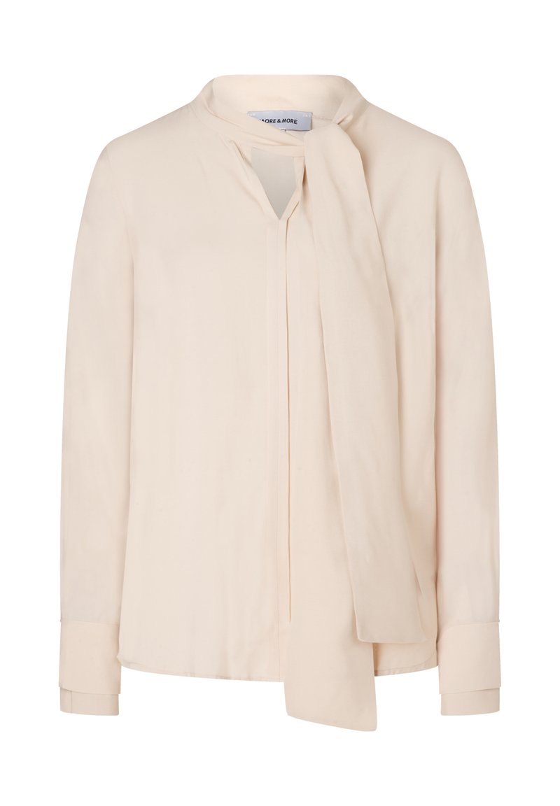 Hellbeige Bluse mit langen Ärmeln, V-Ausschnitt und einer befestigten Schleifen-Details am Kragen. Glatte Stoffoberfläche ohne sichtbare Muster.