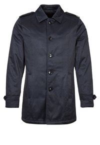 Mörkblå rock i mjukt tyg med knäppning framtill, axelklaffar och sidofickor. Rakt skuren med långa ärmar.