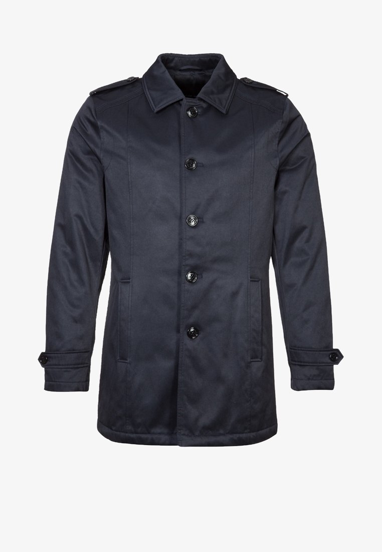 Mörkblå rock i mjukt tyg med knäppning framtill, axelklaffar och sidofickor. Rakt skuren med långa ärmar.