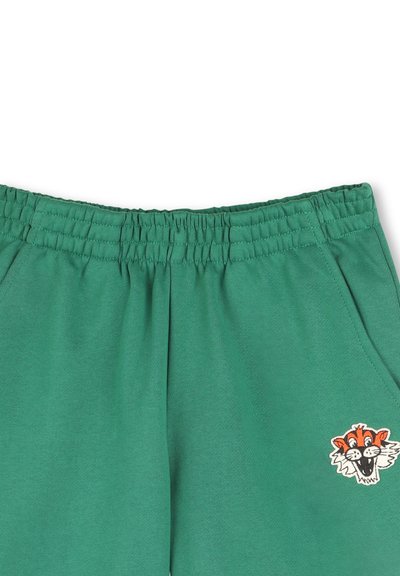 Groene katoenen sweatpants met een elastische tailleband en zijzakken, met een geborduurde dierenface-design op de linkerdij.