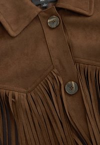 Brown suede jacket featuring a collar, two buttons, and fringe detailing along the front. Smooth texture with a soft finish.
