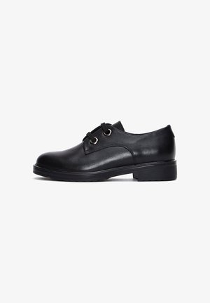 Black leather oxford shoe with round toe, two eyelets, and textured sole; smooth finish and minimal accents.