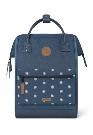 Blue fabric backpack with a textured finish, featuring a floral pattern, leather accents, top handle, and front zipper pocket.