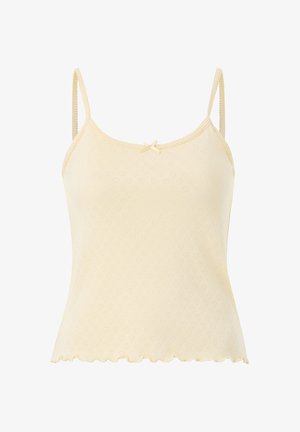 Kremfarvet kvindetop med tynde stropper, lille sløjfe ved halsudskæringen, tekstureret hjerte-mønster og bølget kant.