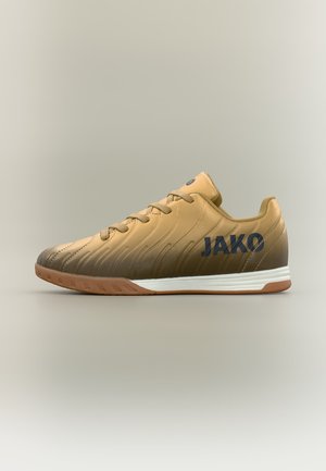 Chaussure de football d'intérieur dégradé beige et marron avec semelle en gomme et logo noir JAKO sur le côté, montrée de la face extérieure.